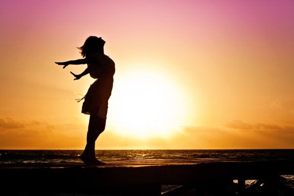 Lady silhouette hands back with joy